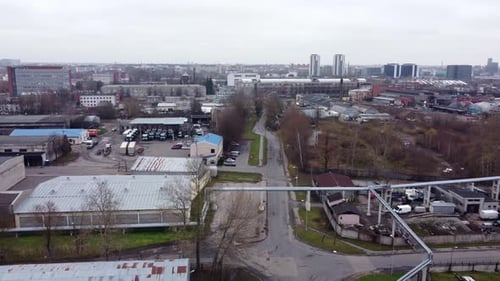 Wide Aerial of Riga Harbor with Shipping Cranes