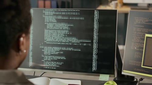 Young Adult Working with Computer Code