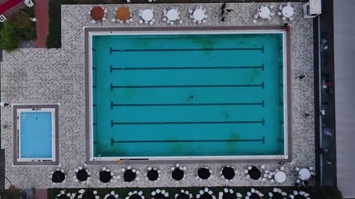 Aerial Video Top View of Empty Swimming Pool with Lanes in Resort
