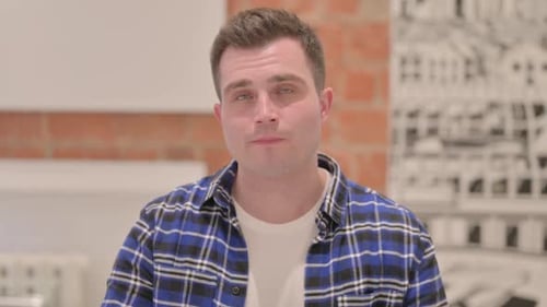Portrait of Brainstorming Young Casual Man with New Idea