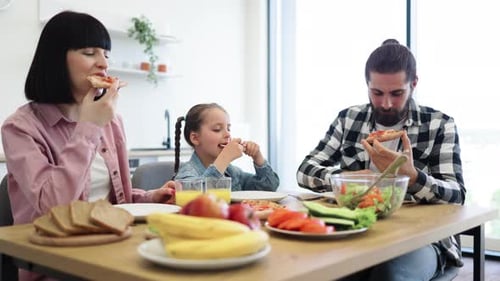 Family Enjoys Meal Together at Home