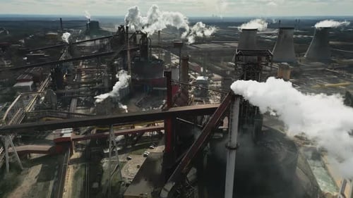 Aerial View of Large Industrial Complex With Smoke
