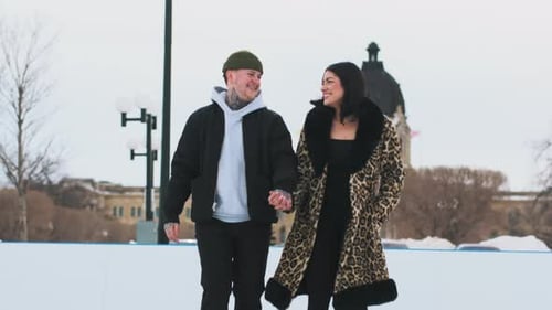 Happy Couple Ice Skating Together on Winter Date