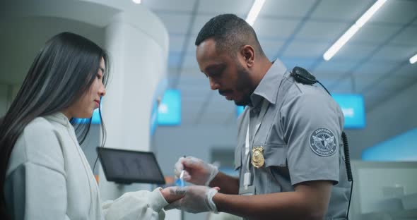 Airport Terminal Security Officer Conducts TSA Hand Swab Screening to ...