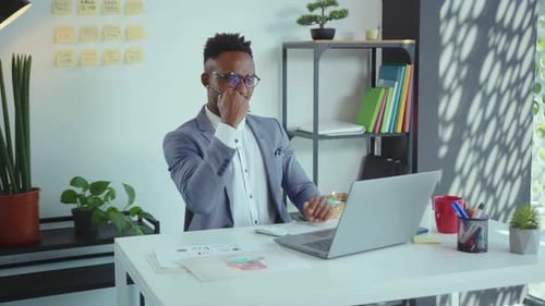Happy African American Handsome Man Uses Computer for Work in Modern Office Programmer Looks at