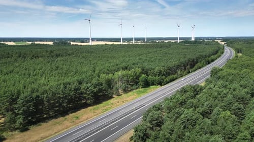 Horizon Wind Power and Green Energy Wind Turbines Produce Energy in the Field Near the Road and