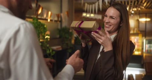 Woman Receives Birthday Gift in Cafe