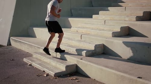 Man Running Stairs in an Urban Setting