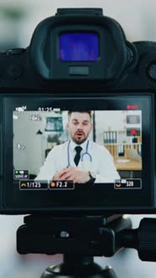 Close Up Professional Camera Shooting on Man Doctor Medic in White Coat Which Streaming Advices for