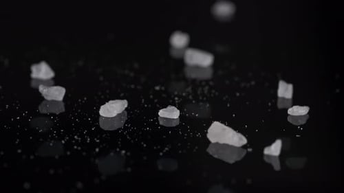 Sea Salt Falling on Glass Floor 4K