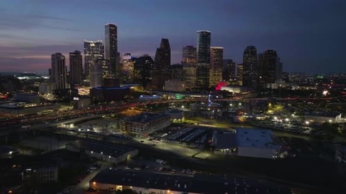 Establishing drone shot of the Houston city skyline, vibrant dawn in Texas, USA