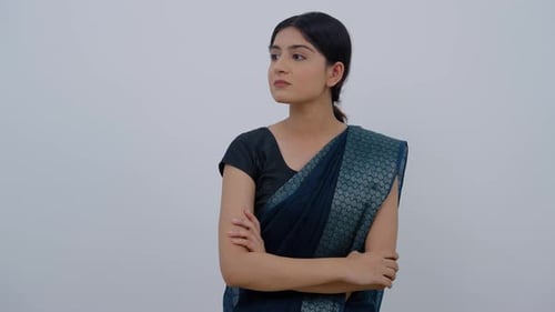 Young Woman in Saree Looking Thoughtfully Around