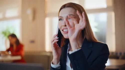 Business Manager Consulting Smartphone in Cafeteria Closeup Smiling Woman