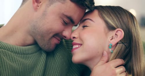 Affectionate Couple Embracing with Foreheads Together