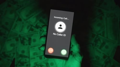 Close-Up of a Hand Holding a Smartphone Displaying an Incoming Call Screen Labeled "No Caller ID,"