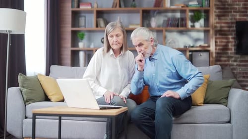 Senior Couple Using Laptop Together at Home