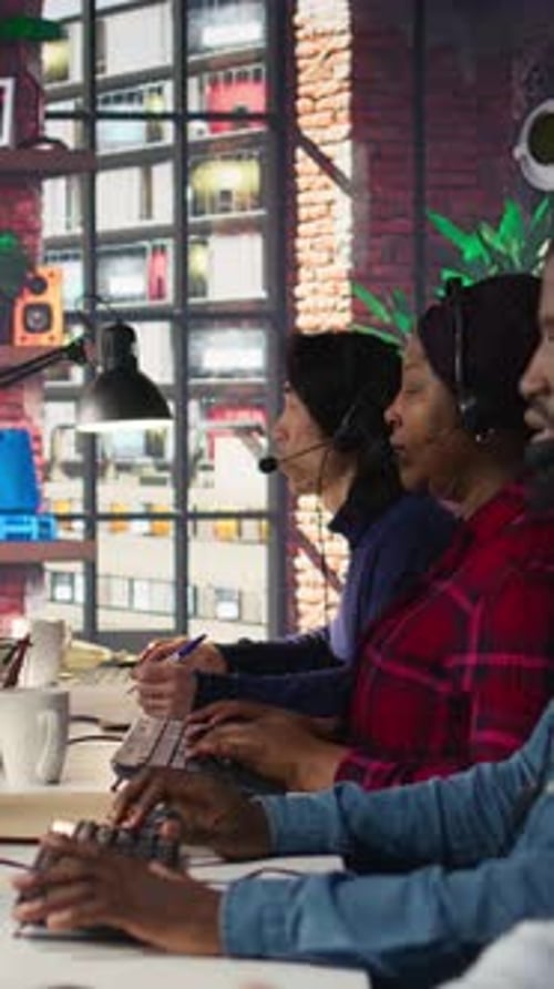 Vertical Video Call Center Employees Wearing Headset Assisting Customers in Office Close Up