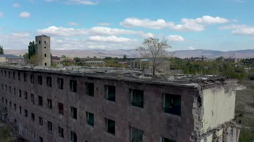 Damaged buildings outdoors, aerial footage. Aerial view abandoned, destroyed building in city.
