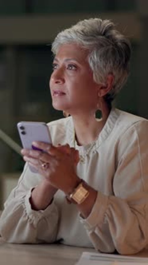 Mature woman, smartphone and typing for internet, website and online application in office at night