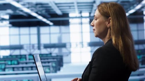 System Administrator in Data Center Running Error Checking Utilities on Laptop