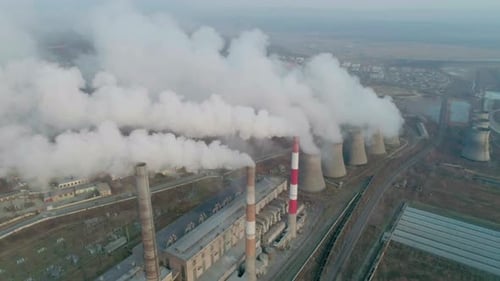 Aerial Orbital View of an Industrial Zone Pipes Pouring Thick White Smoke Thick Smoke Plumes Thermal