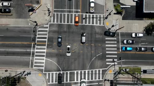 Timelapse of vehicles moving through intersection - Aerial