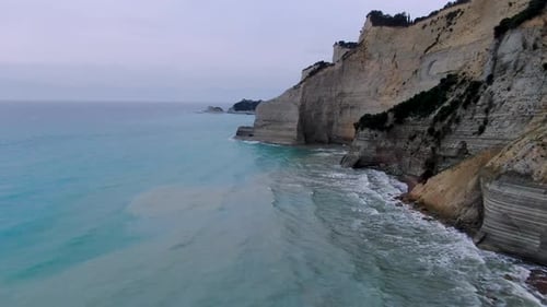 drone flight along the dramatic white cliffs and sea stacks of Peroulades, Corfu