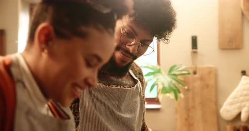 Couple Cooking Together in Sunny Home Kitchen