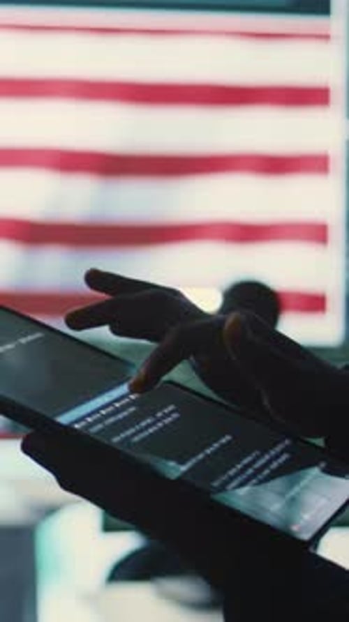 Fingers Use Tablet for Coding with USA Flag