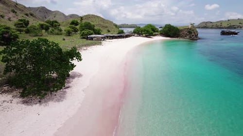 Experience the stunning shores of Pink Beach in Komodo National Park, featuring its distinctive pink