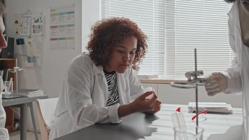 Young Adults Working Together in Science Lab