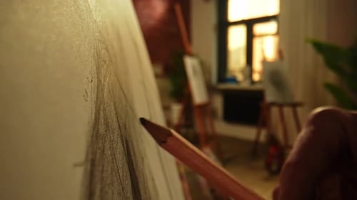 Person at Easel Drawing on Canvas During Art Class in Studio Close Up Shot of Hand with Pencil