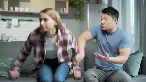 Couple Arguing and Having Relationship Difficulties on Couch