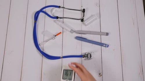 Medical Equipment Flat Lay with Blood Sugar Monitor