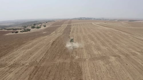 Tractor tilling in Judea Plain, Drone footage, Israel