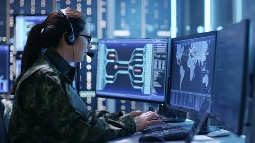 Woman in Military Uniform Working at Computer