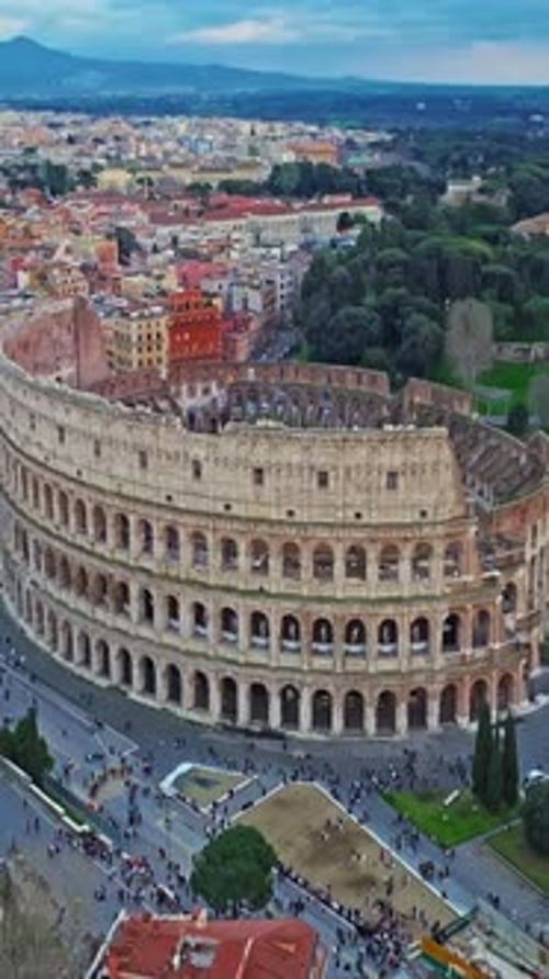 Establishing Shot Drone Flying of the Colosseum Famous Ancient Roman Arena Downtown Rome Italy The