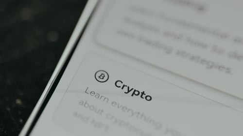 Crypto Education App on Smartphone Display Close Up