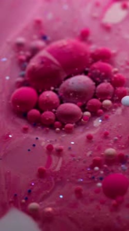 Abstract Pink Liquid and Spheres Close-Up