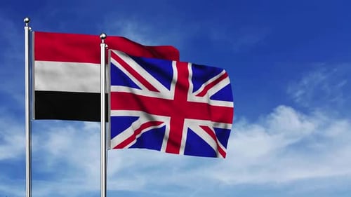 Yemen and United Kingdom Flags Waving in the Wind
