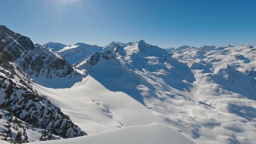 Panorama of Majestic Snowy Mountain Peaks of Main Alpine Ridge in Winter Nature Landscape