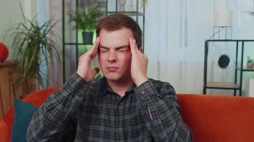 Young Man Experiencing Headache and Stress