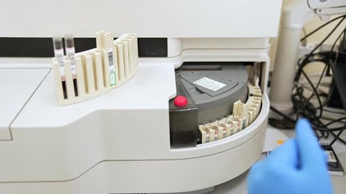 Medical Machine Processing Test Tubes in Lab