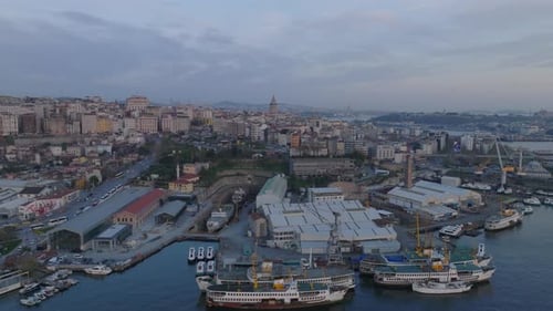 Aerial Slide and Pan Shot of Urban Borough at Dusk Shipyard on Bank Apartment Buildings and Busy