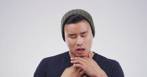 Man With Sore Throat Holds Neck In Pain