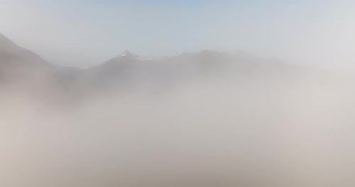 Mountains Emerging From Veils Of Mist