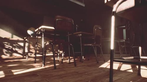 View to Classroom with Tables and Small Blackboard and Grungy Walls