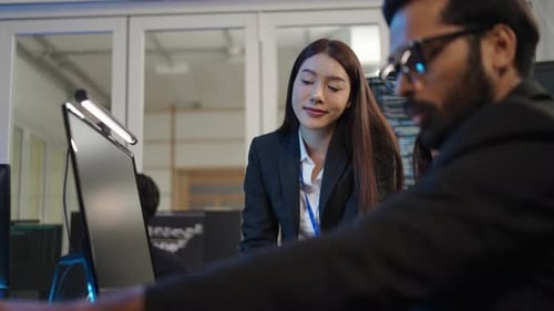 Group of programmers are coding at office.
