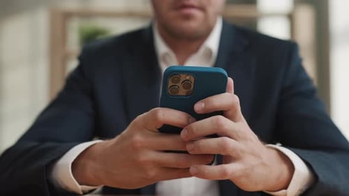 Business Man Hands Using Smartphone in Office Work Room Front View. Person