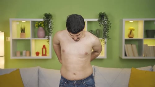 Male waist measures body fat. Obesity and weight loss.